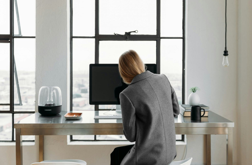 A woman sitting in front of a computer.